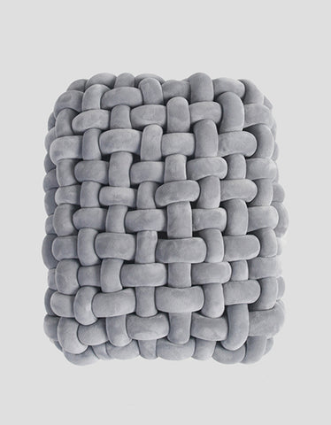 Gray plush woven dressing table stool with thick knot texture and soft interlocking looped strands for knot dressing