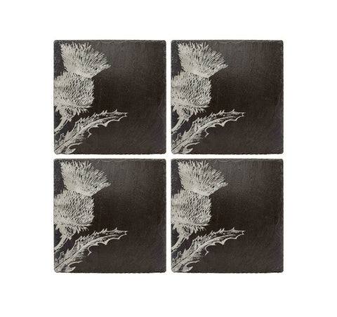 Set of four dark slate coasters with white etched thistle flower designs perfect for protecting surfaces