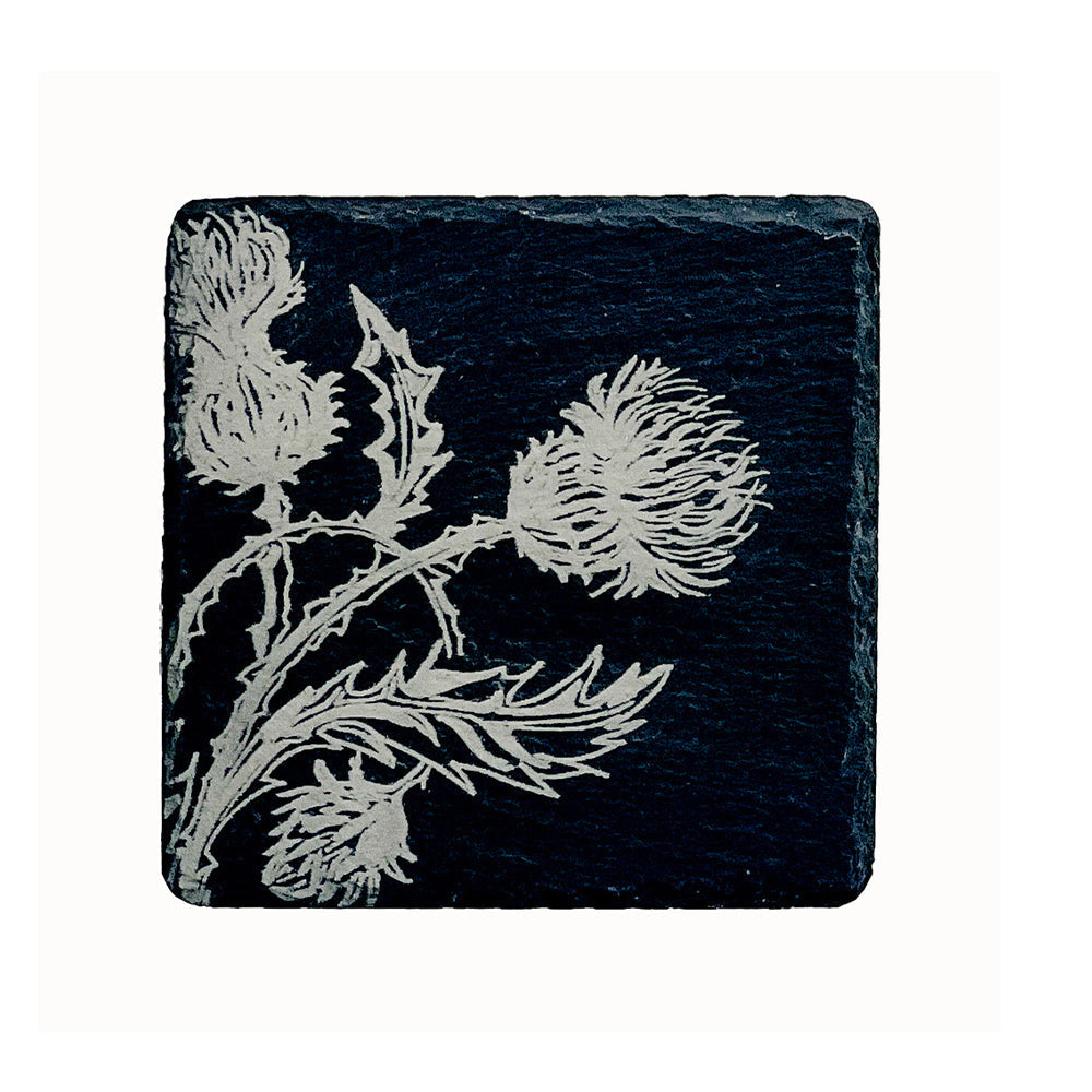 Dark slate single slate coaster with an intricately engraved silver thistle design from the thistle trio collection