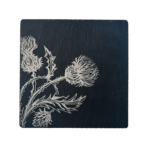 Dark slate pot stand featuring an intricately engraved white thistle design perfect as a slate pot stand