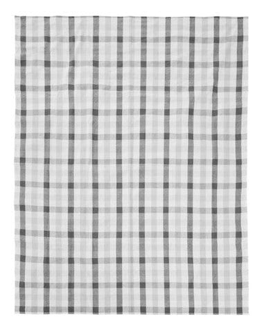 A white and gray checkered fabric napkin with a subtle grid pattern from thread and loom black check tablecloth set