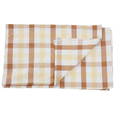 A folded beige and white checkered cloth napkin with a classic plaid pattern for terracotta gingham tablecloth use