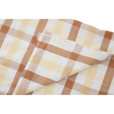 Folded beige and brown woven cotton terracotta gingham tablecloth with a classic gingham tablecloth pattern