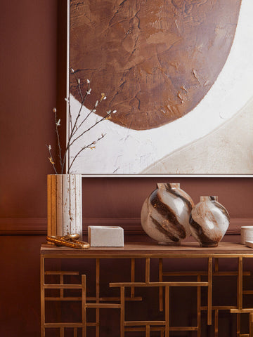 Two glossy tibor travertine ribbed vases with swirling brown and white patterns on a wooden console table