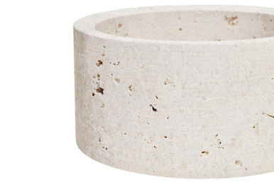 Cream-colored tibor travertine round concrete trinket box with a textured speckled surface and rounded shape