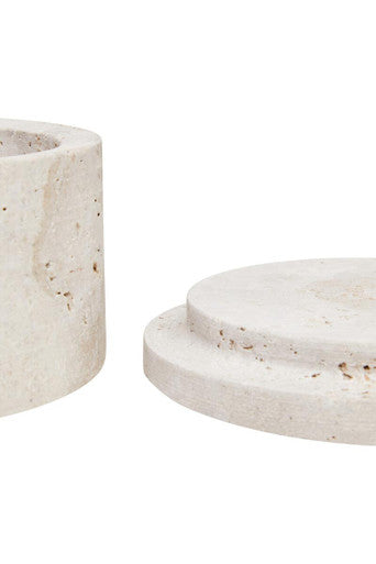 Cream-colored tibor travertine round candle holder with speckled textured surface and tiered circular base
