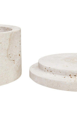 Cream-colored tibor travertine round candle holder with speckled textured surface and tiered circular base