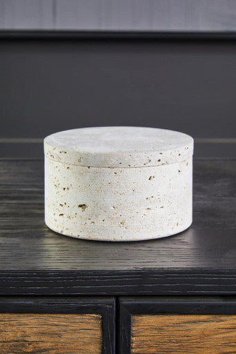 A tibor travertine round off-white concrete trinket box with speckled texture and matching lid