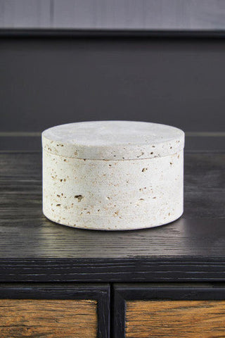 A tibor travertine round off-white concrete trinket box with speckled texture and matching lid