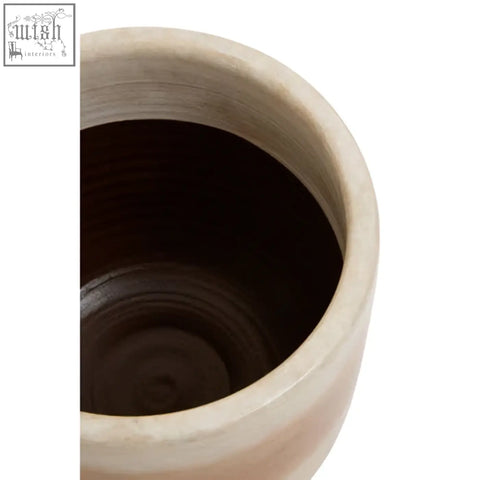 Beige ceramic tierra earthenware planter with smooth rounded rim and dark interior natural earthenware planter
