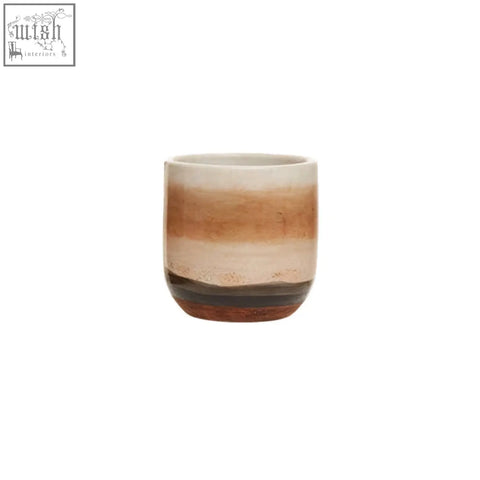 Tierra earthenware planter with a rounded shape and earthy gradient tones in a natural earthenware planter design