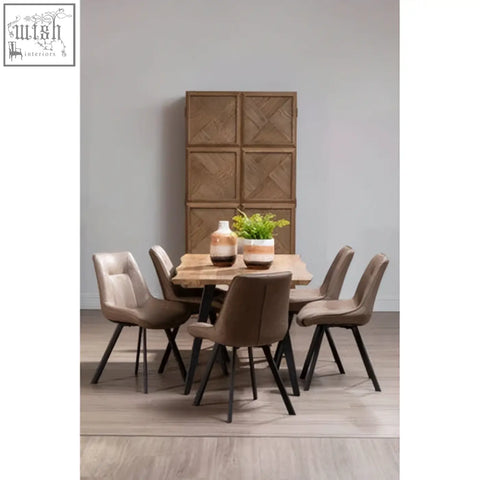Modern dining set with rustic wood table and six taupe upholstered chairs featuring natural earthenware planter