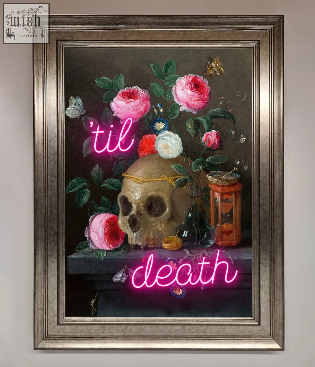 A framed til death skull wall art featuring a skull with golden band surrounded by pink roses and neon text til death