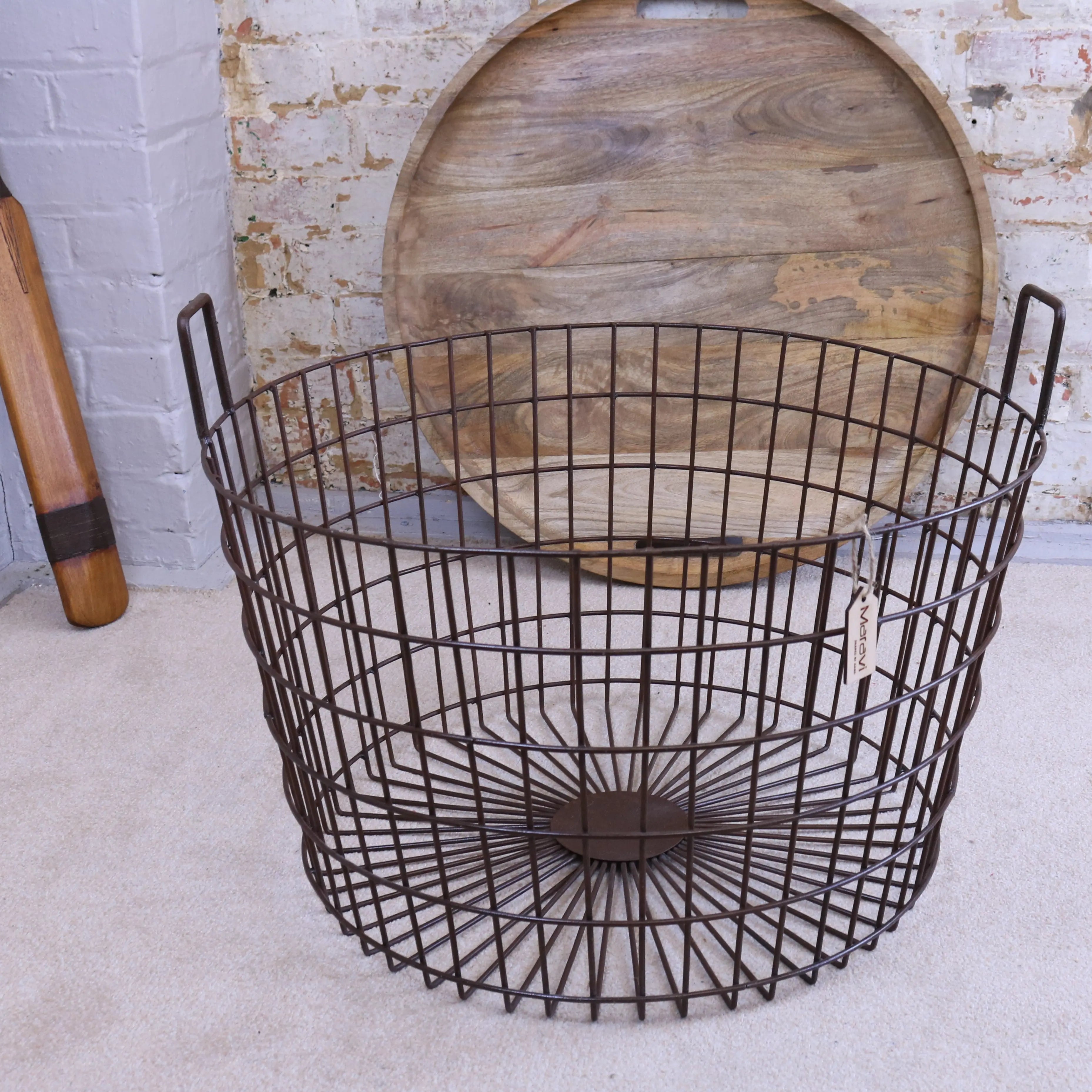 Dark brown metal wire industrial basket table with two handles and circular grid design with wood lid