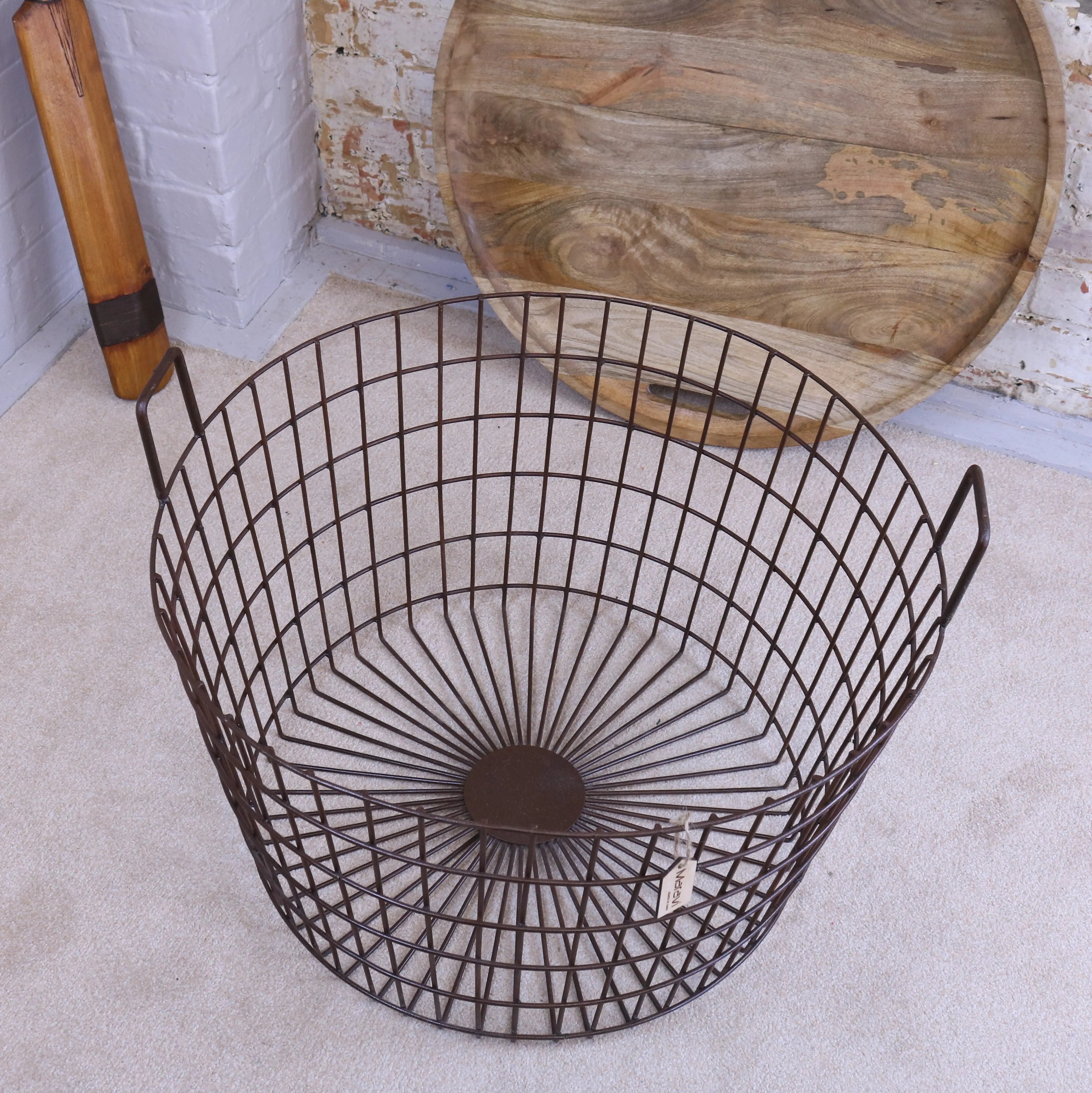 Dark brown metal wire industrial basket with radial pattern and handles for tilpi industrial basket table use