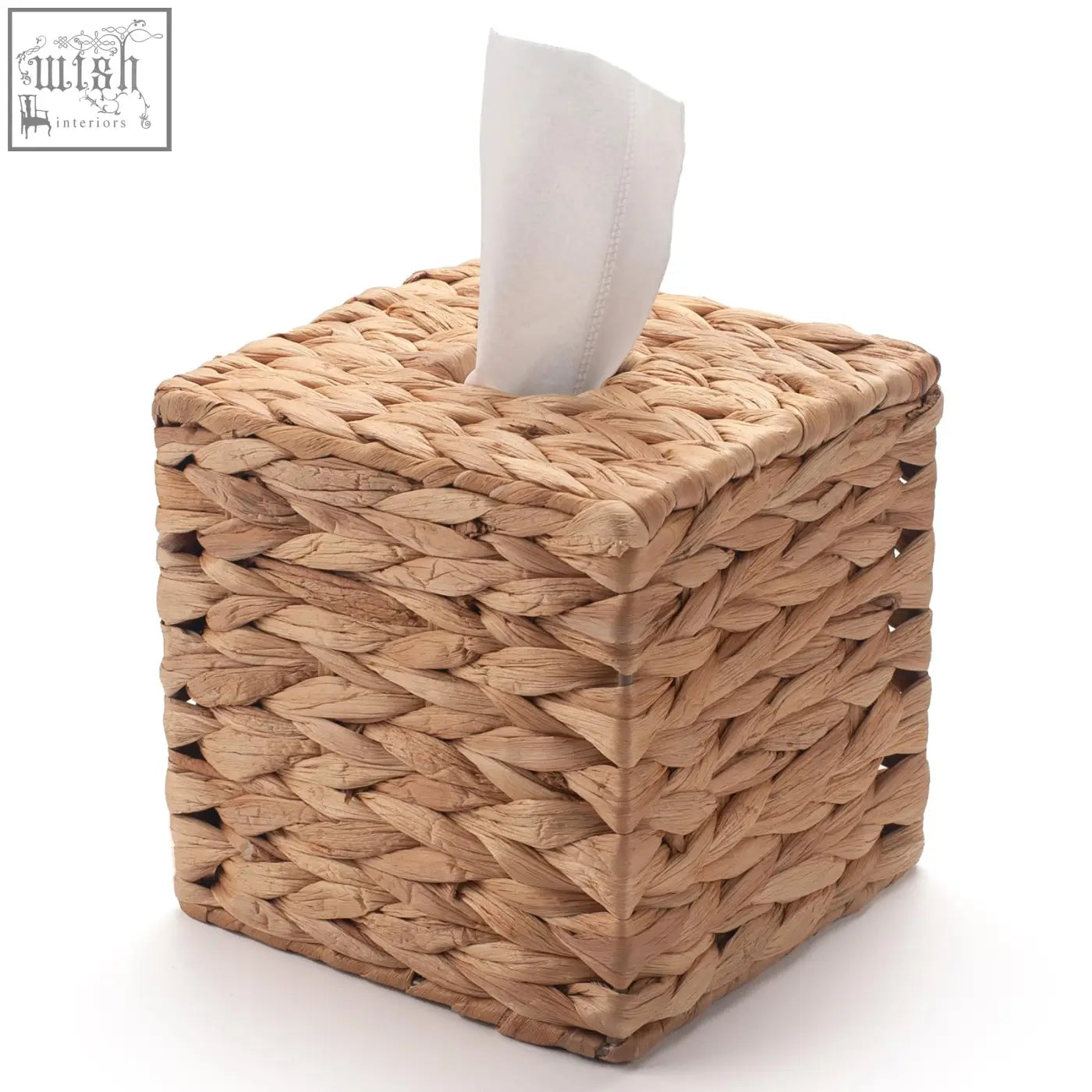 Natural woven wicker tissue box holder with white paper towel partially pulled out on table and bathroom use
