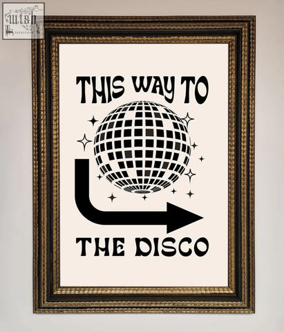 A black and white disco framed poster with a disco ball and arrow design saying this way to the disco in a frame