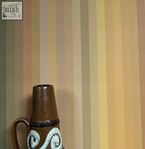 Brown ceramic vase with black band and white swirling patterns complementing tonal stripe wallpaper ochre color ways