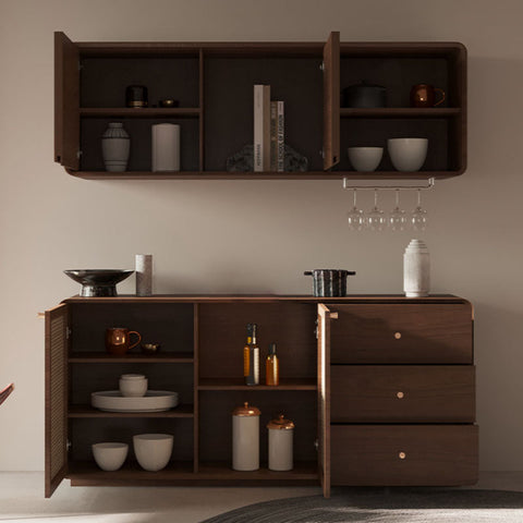 Dark wood topaz cabinet with open doors showing shelves and drawers holding ceramic bowls books and glassware