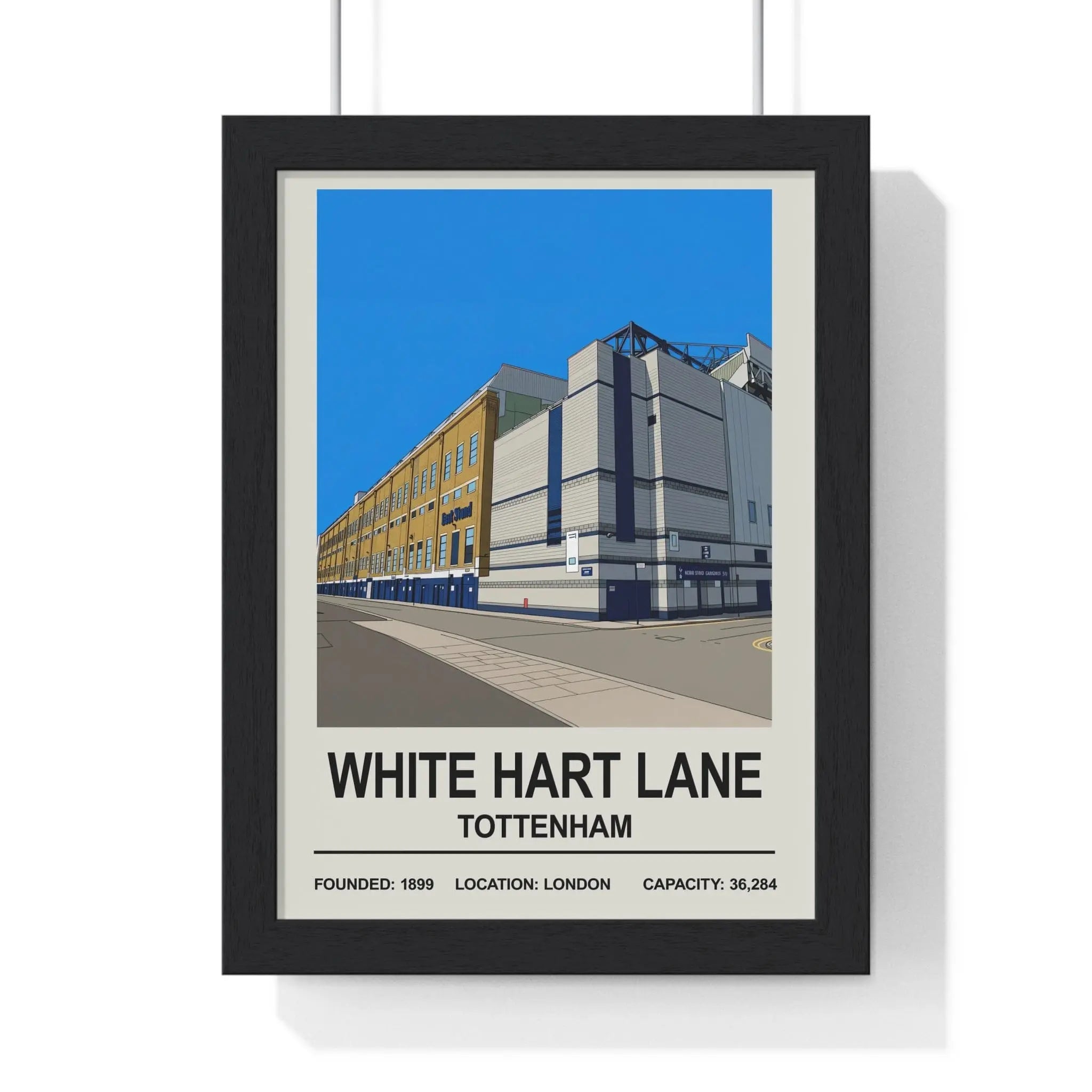 Black-framed poster with a stylized white hart lane stadium illustration in tottenham london print