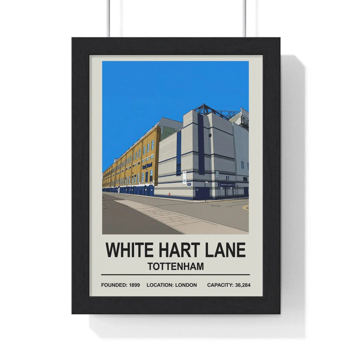 Black-framed poster with a stylized white hart lane stadium illustration in tottenham london print