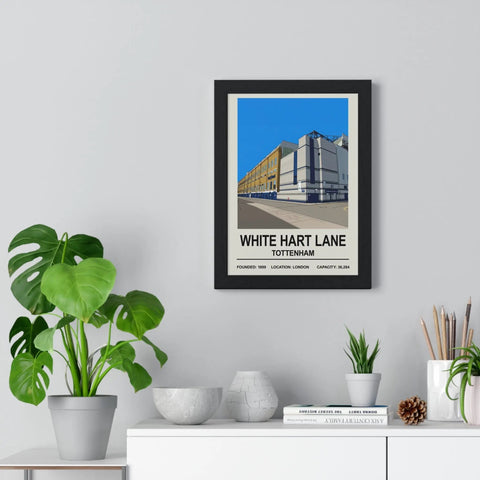 Black-framed white hart lane exterior print poster with bold typography and stylized illustration against blue sky