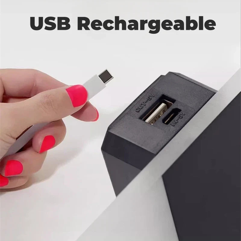 Hand holding black usb rechargeable power adapter with dual ports and white cable for touch sensor wall light