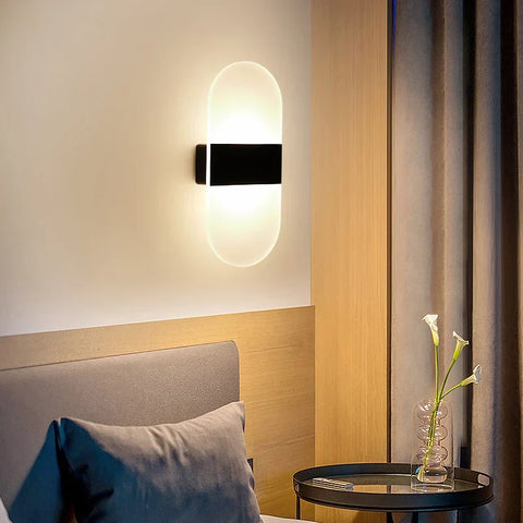 Modern oval-shaped usb rechargeable touch sensor wall light with frosted glass diffuser and black metal frame emitting warm light