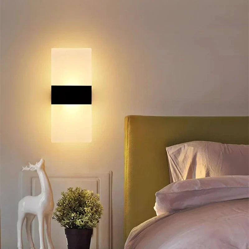 Modern rectangular touch sensor wall light with sleek black band on white acrylic usb rechargeable sconce emitting warm light