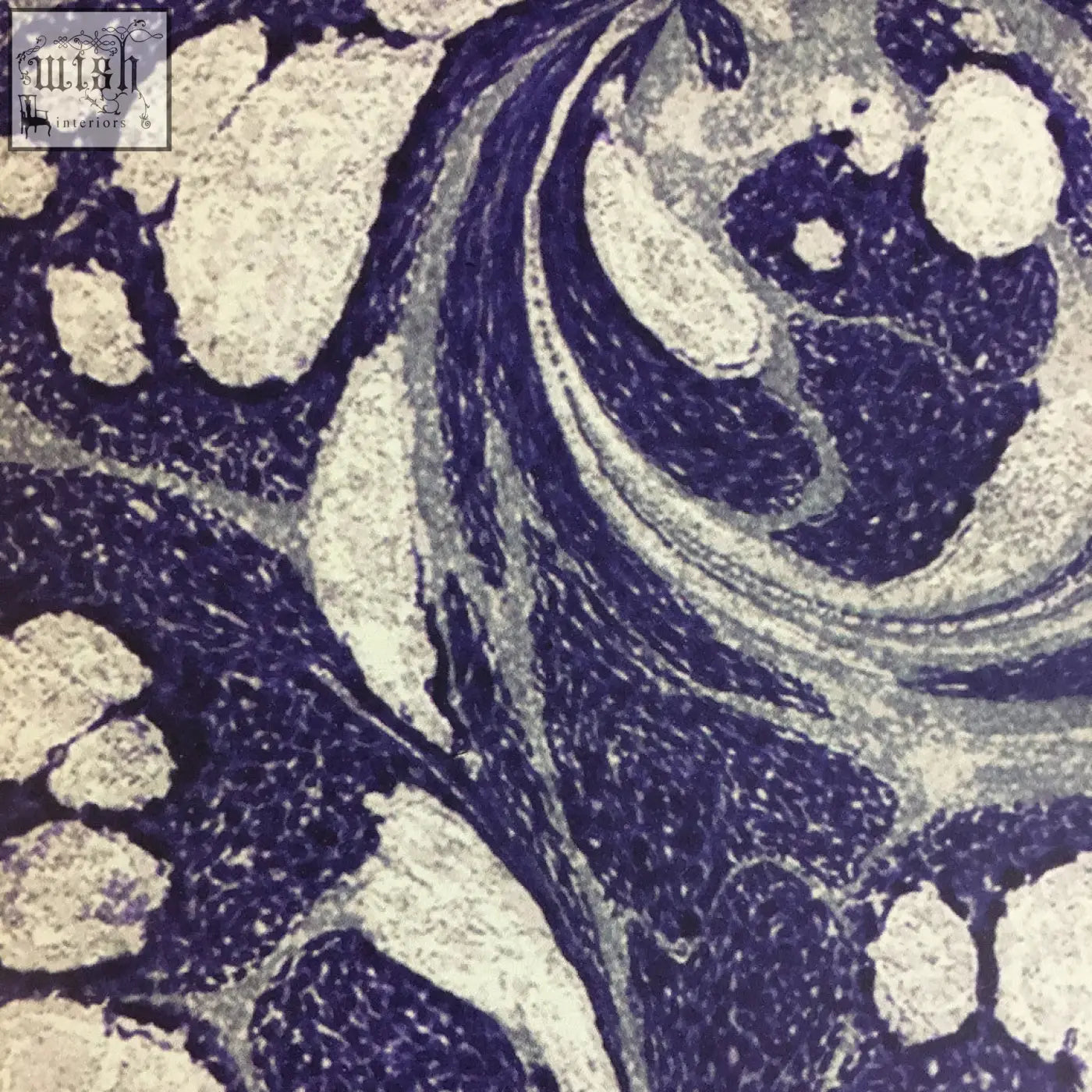 Tourmaline wallpaper showing a deep navy blue and creamy white textured fabric with an intricate marbled pattern check shipping times