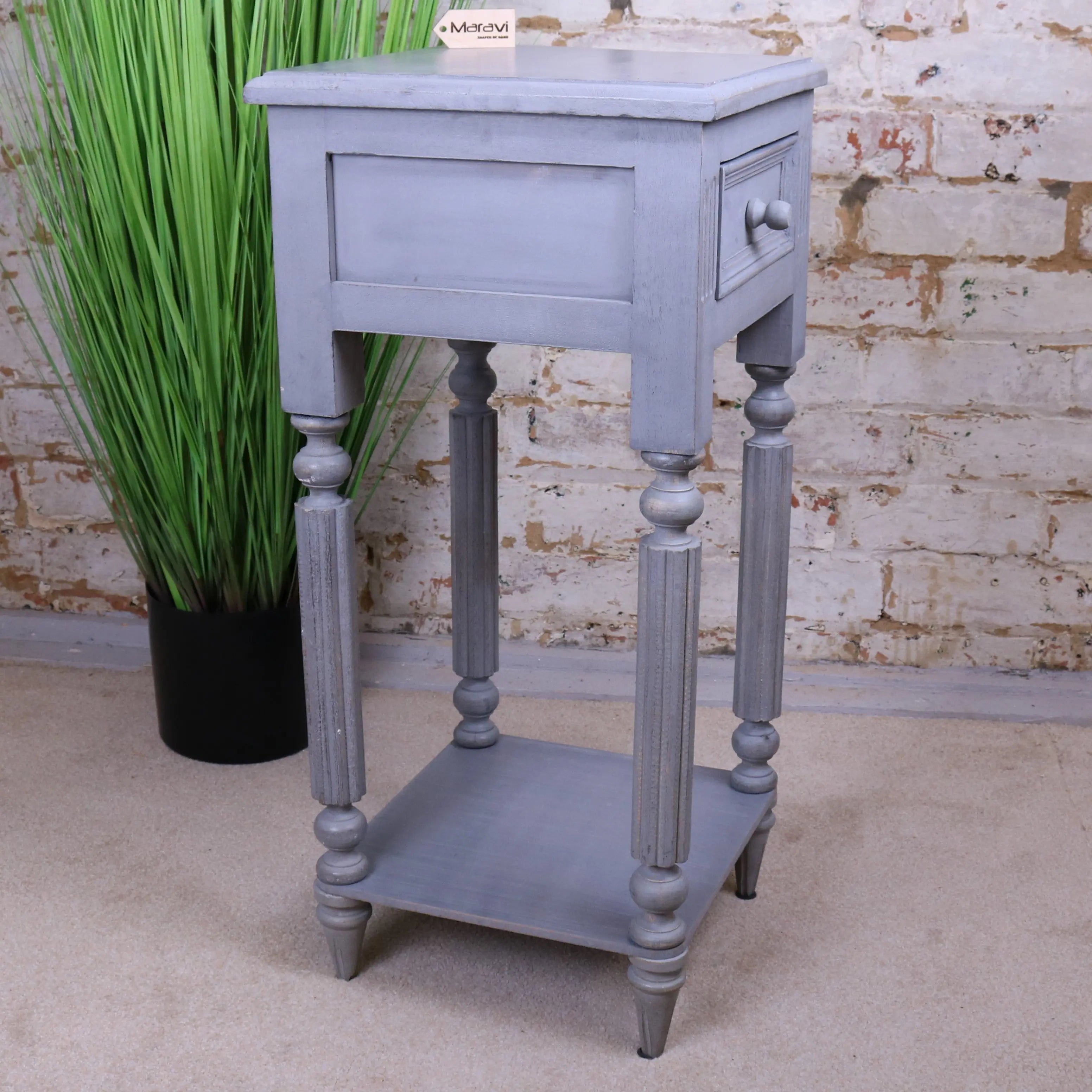 Gray distressed wooden toyani square tall display table with turned legs and single drawer for stylish storage