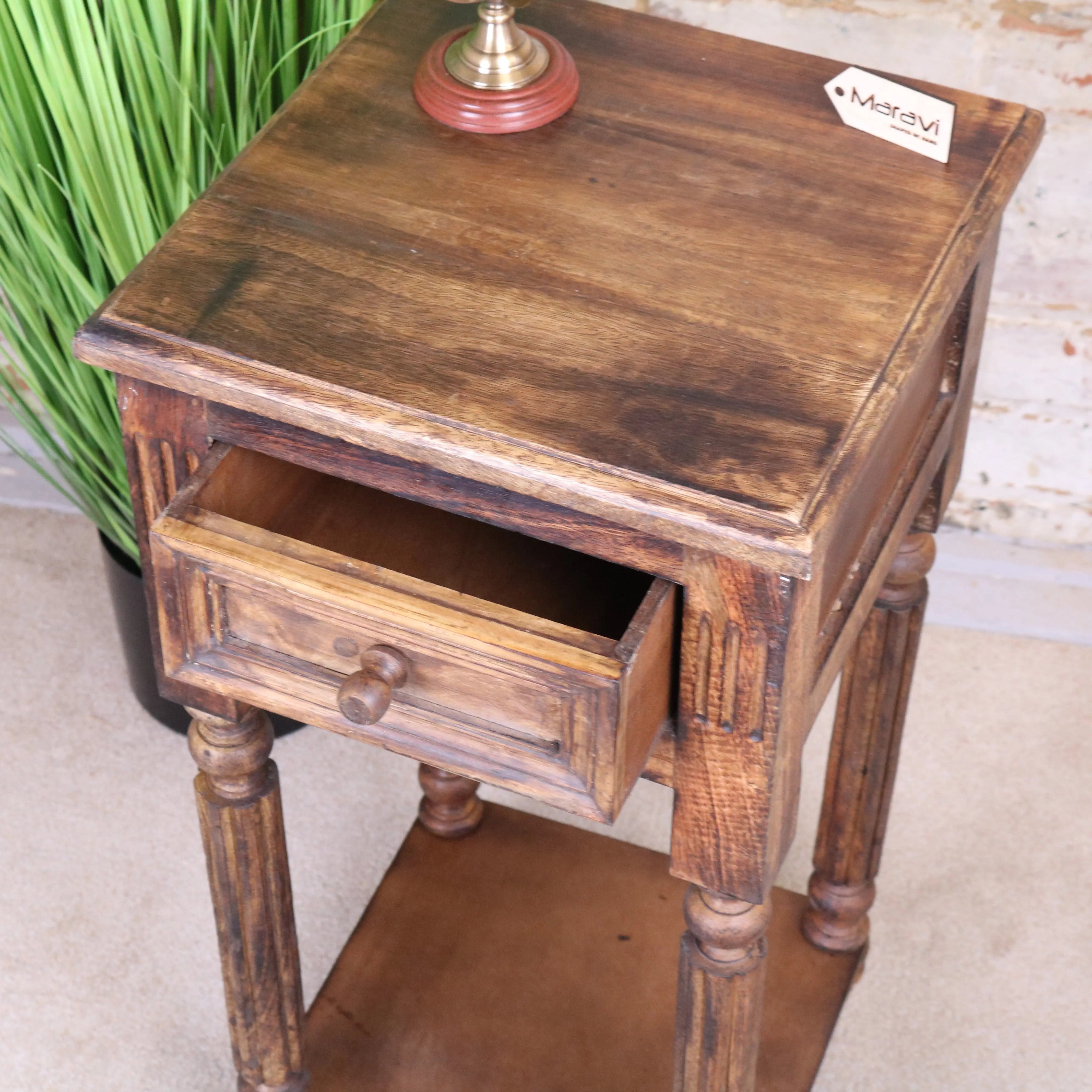 Rustic brown wooden toyani square tall display table with a single drawer and turned legs as a display table