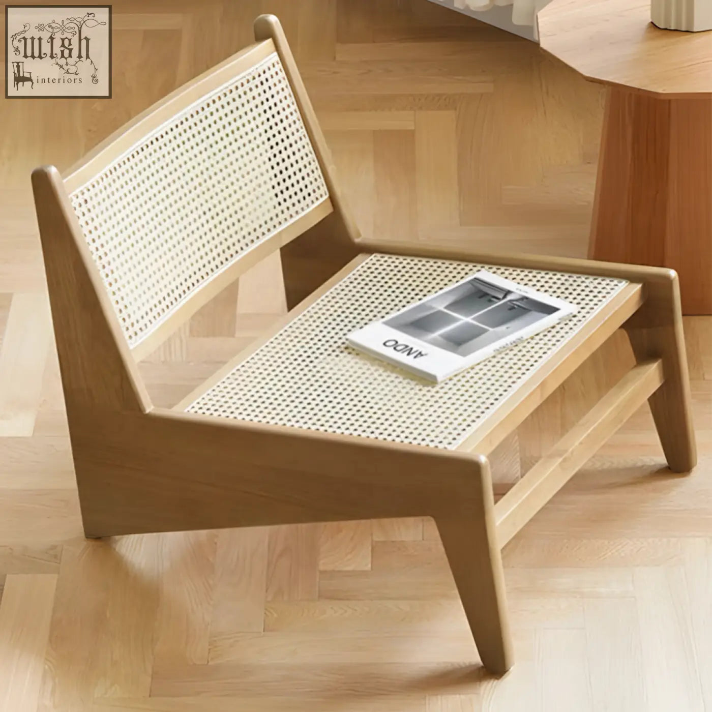 Minimalist tracyh lounge chair with light wooden frame and woven rattan seat and backrest for cozy lounging