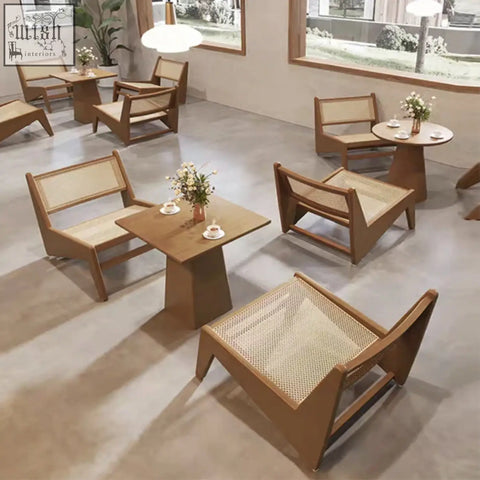 Modern tracyh lounge chair with wooden frame and woven cane rattan seat and back in warm natural finish