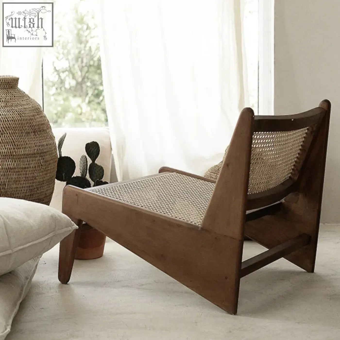A sleek wooden tracyh lounge chair with woven natural rattan seat and backrest featuring clean lines