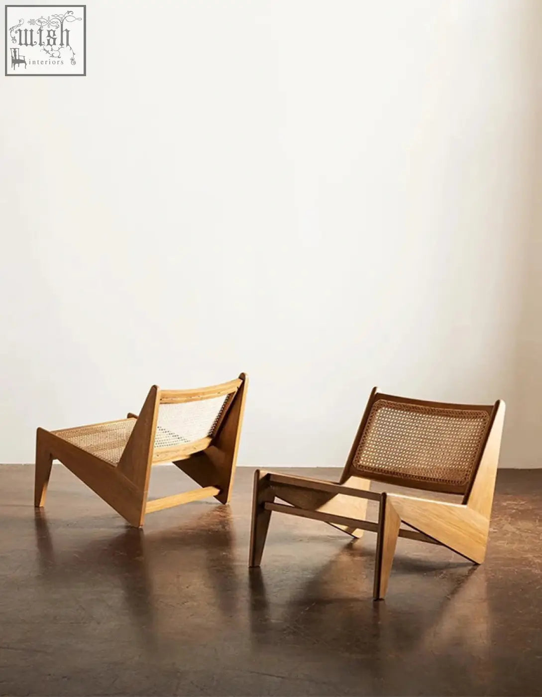 Two tracyh lounge chairs with woven rattan backs and seats in a natural light wood finish perfect for lounging