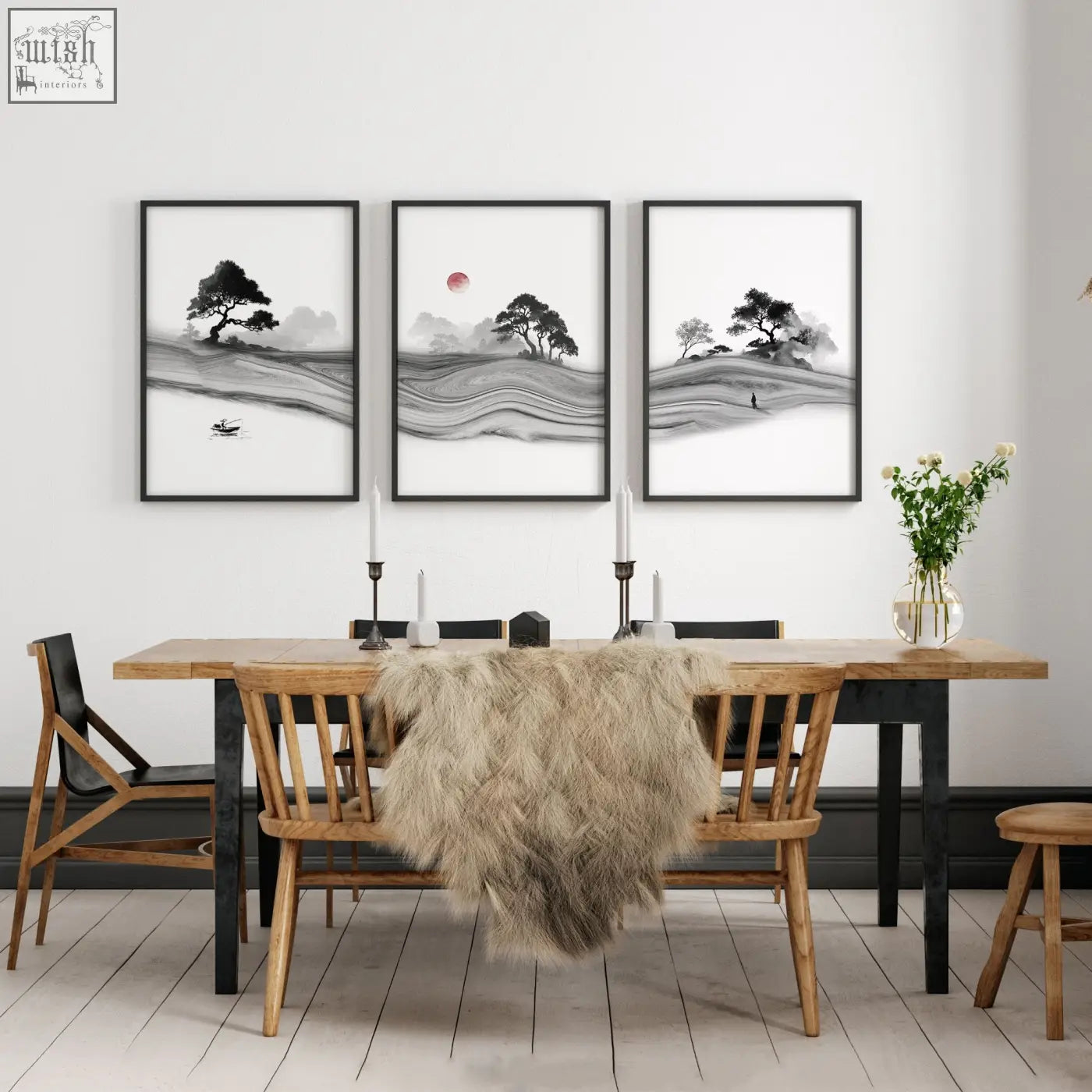 Three framed black and white ink wash traditional japanese wall art prints with red sun above wooden dining table