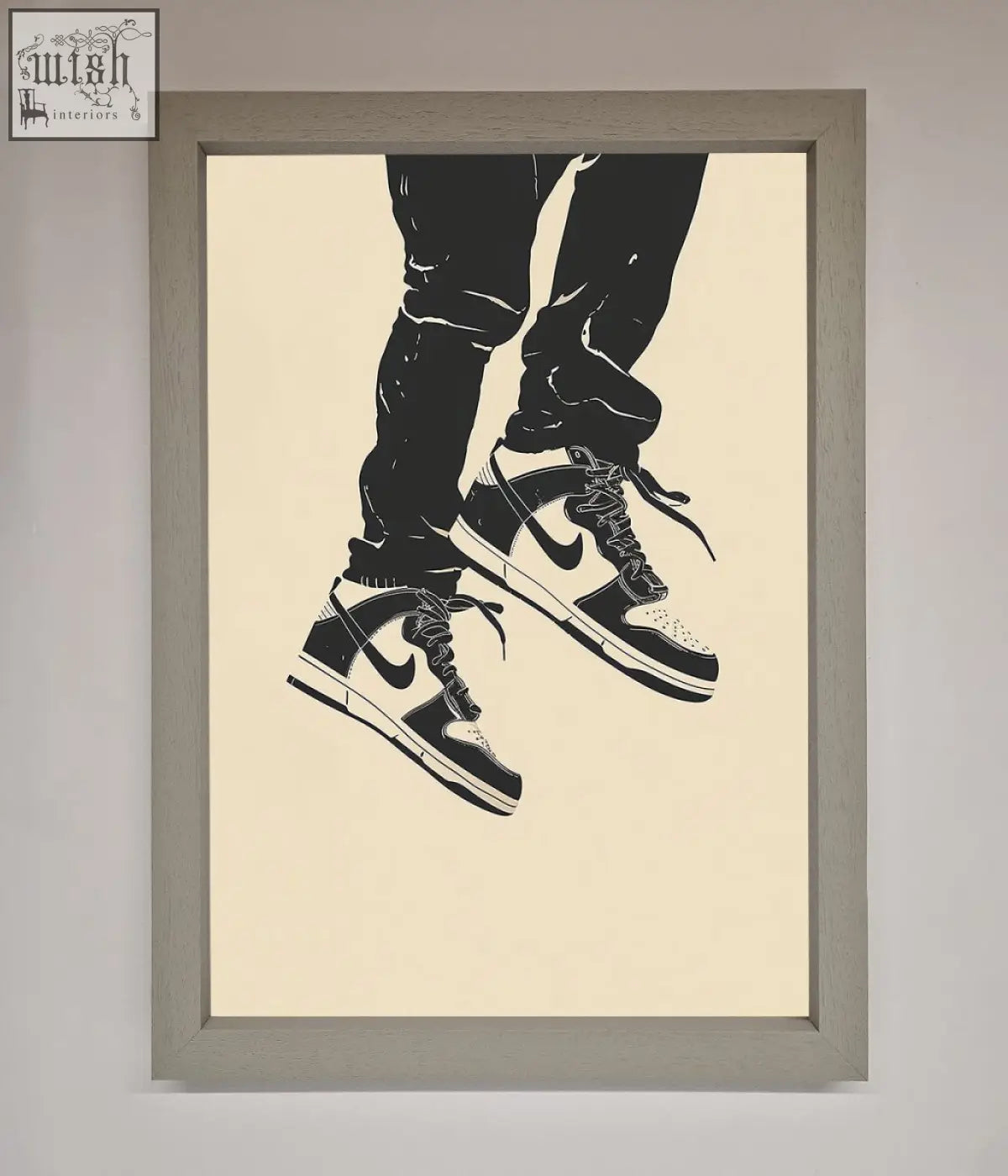 Trainers bouncing framed wall art featuring black and white nike dunk low sneakers with classic swoosh design in gray frame