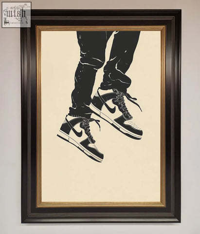 Black and white nike dunk low trainers bouncing framed wall art in a detailed ornate dark frame graphic print