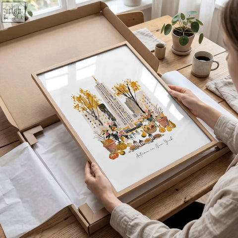 A travel poster art print of new york city in autumn with empire state building golden trees and pumpkins in a wood frame