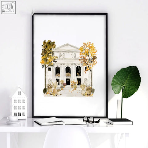 A framed travel poster art print of a classical empire state building with autumn trees in a black frame