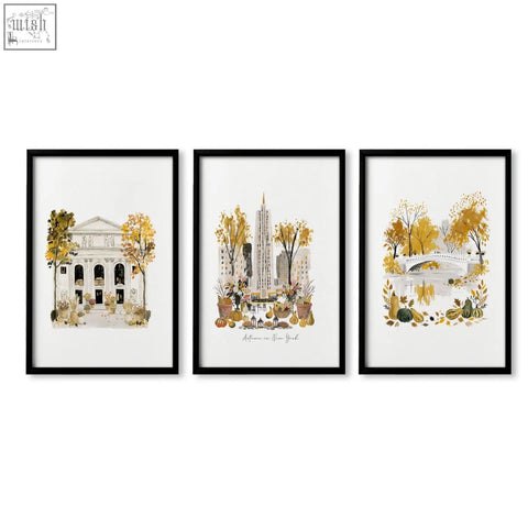 Set of three black-framed watercolor travel poster art prints featuring autumn scenes of new york city empire state