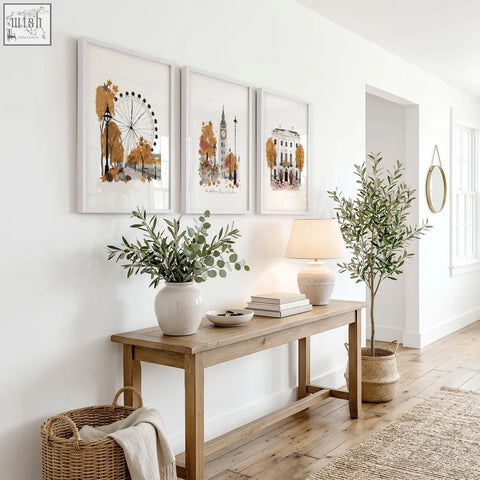 A white ceramic vase with eucalyptus branches as travel room decor for london autumn watercolor wall art prints set of 3