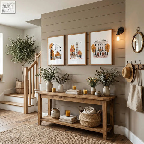 Rustic wooden console table with natural finish and shelves styled with travel room decor featuring london autumn prints