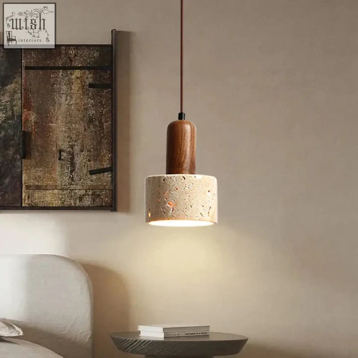 A warm-toned travertine pendant light with a cylindrical wooden top and textured beige concrete shade for kitchen island