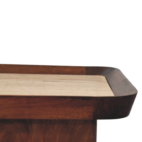 Dark wood coffee table with a light travertine top and rounded edges perfect for stylish living rooms
