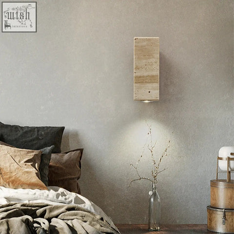 Rectangular travertine wall light with natural beige and tan veining perfect for indoor outdoor use