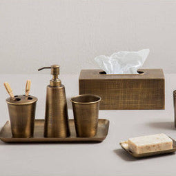 Brass tissue box with textured finish and matching tray from the traez bathroom accessory set