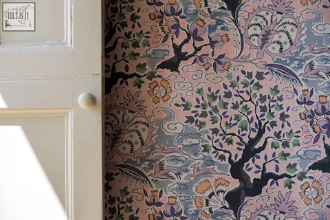 Pink wallpaper with vintage french inspired intricate black green and orange floral tree of life pattern