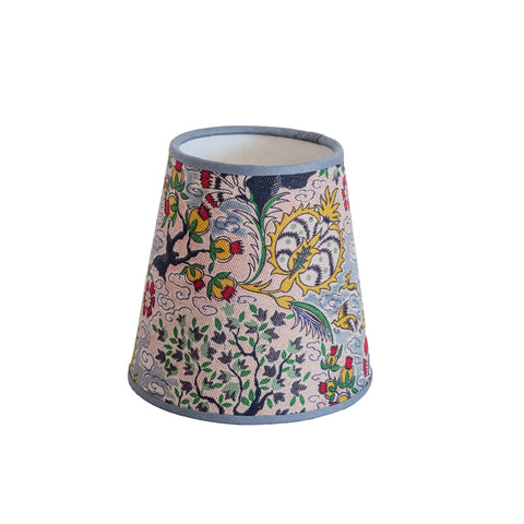 Tree of life lampshade with vibrant floral and bird pattern on light pink fabric and soft gray trim